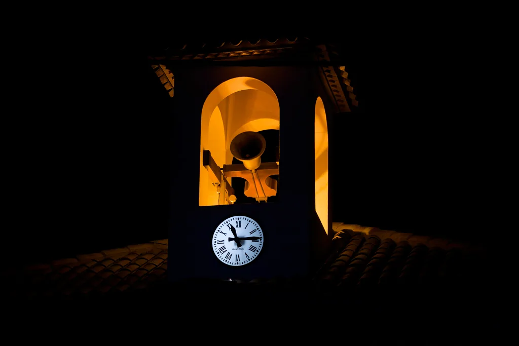 The church bell rings when the procession arrives.