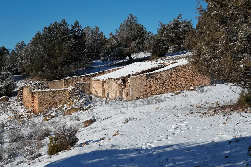 The snow-covered sheepfold, which marks the turning point of the route