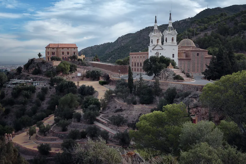 A 2013 photograph of the Fuensanta Sanctuary, the priests’ residence, and, on the right, the “Cueva de la Cómica” cave A 2013 photograph of the Fuensanta Sanctuary, the priests' residence, and, on the right, the “Cueva de la Cómica” cave