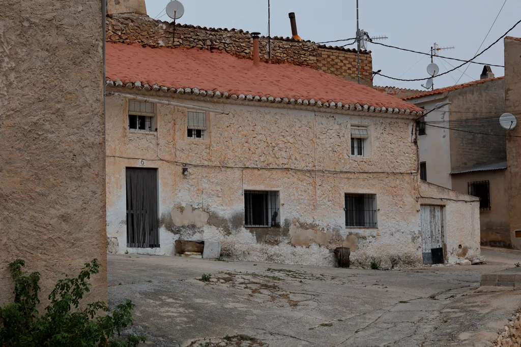Traditional village homes in El Sabinar trapped beneath a dense, grey-white haze veil as global warming pushes high-altitude summer temperatures to historic highs. Traditional village homes in El Sabinar trapped beneath a dense, grey-white haze veil as global warming pushes high-altitude summer temperatures to historic highs.