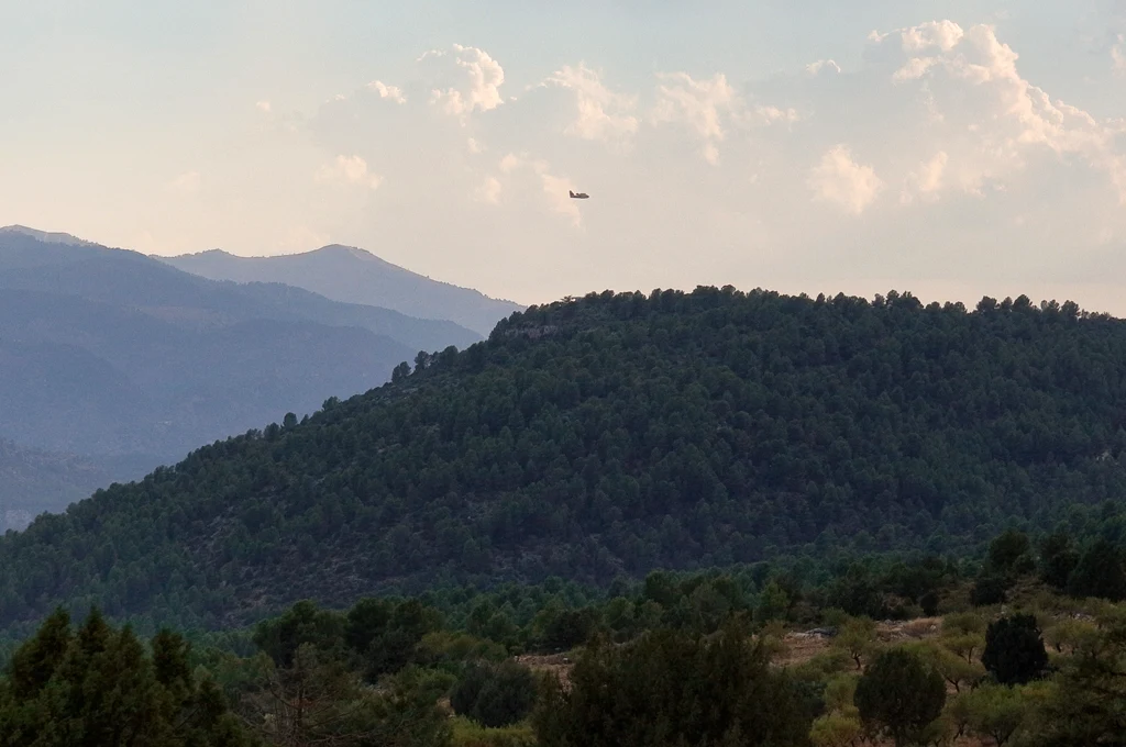 One of the fire-fighting aircraft is returning to base One of the fire-fighting aircraft is returning to base