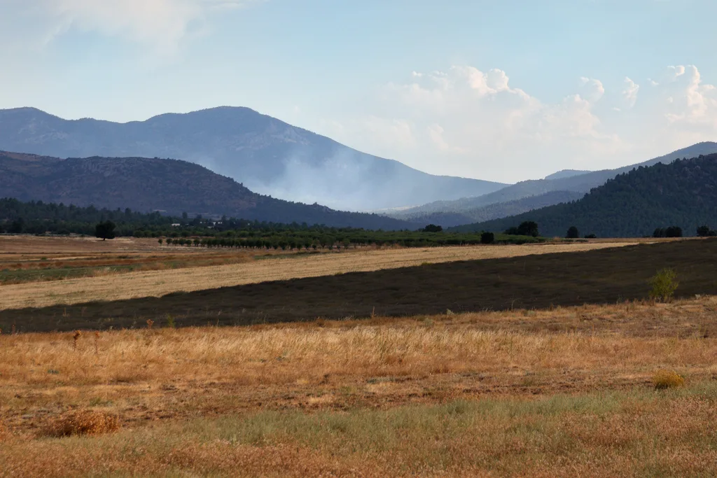 Two helicopters assisting with fire-fighting operations Two helicopters assisting with fire-fighting operations